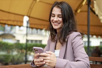Woman using a smartphone for WhatsApp messages